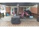 Back deck featuring patio furniture and a corrugated roof at 13065 Allman Dr, Mooresville, IN 46158