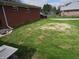 Lush backyard with manicured grass and partial view of the property's side at 13065 Allman Dr, Mooresville, IN 46158