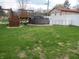 Backyard with an above ground pool, play set, and white privacy fence at 13065 Allman Dr, Mooresville, IN 46158