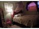 Bedroom view featuring a cozy bed, decorative quilt, bedside table and decor at 13065 Allman Dr, Mooresville, IN 46158