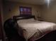 Cozy bedroom with dark furniture and a patterned bedspread at 13065 Allman Dr, Mooresville, IN 46158
