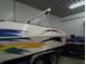 A motorboat with a canopy sits on a trailer in a storage garage at 13065 Allman Dr, Mooresville, IN 46158