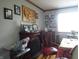 Dining room showcasing decoratively adorned walls, fireplace and a nearby bright window at 13065 Allman Dr, Mooresville, IN 46158
