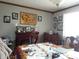 Bright dining room with dark wood furniture and a decorative wall at 13065 Allman Dr, Mooresville, IN 46158