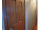 An interior image showing a wooden door with panel detailing and brushed metal hardware at 13065 Allman Dr, Mooresville, IN 46158