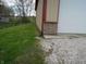 Exterior view of backyard, metal building with retaining wall, gravel and grass at 13065 Allman Dr, Mooresville, IN 46158