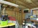 Interior garage view featuring workshop table, storage shelves and exposed insulation at 13065 Allman Dr, Mooresville, IN 46158