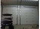 Spacious garage featuring two large doors and ample space for vehicles, storage and a golf cart at 13065 Allman Dr, Mooresville, IN 46158