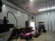 A large garage area is filled with equipment and toy cars at 13065 Allman Dr, Mooresville, IN 46158
