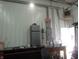 Garage interior with a refrigerator, utility sink, and workbench area at 13065 Allman Dr, Mooresville, IN 46158