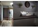 View of a hallway leading into a kitchen with stainless steel refrigerator at 13065 Allman Dr, Mooresville, IN 46158