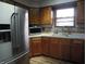 Traditional kitchen featuring wooden cabinets, stainless steel appliances, and natural light at 13065 Allman Dr, Mooresville, IN 46158