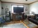 Cozy living room with wood-burning stove, fireplace, leather couch, and natural lighting at 13065 Allman Dr, Mooresville, IN 46158