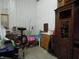 Cluttered storage area inside a garage setting with a sink at 13065 Allman Dr, Mooresville, IN 46158