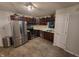Spacious kitchen with stainless steel appliances and dark wood cabinets offers modern convenience at 1317 Mulberry Ct, Greenfield, IN 46140