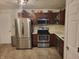 Well-lit kitchen featuring stainless steel appliances and ample cabinet space for storage at 1317 Mulberry Ct, Greenfield, IN 46140