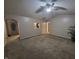 Open-concept living room with neutral paint, ceiling fan, and carpet at 1317 Mulberry Ct, Greenfield, IN 46140