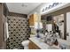 Bathroom featuring a double vanity with decorative mirror and a shower with patterned shower curtain at 14444 Black Farm Dr, Noblesville, IN 46060