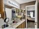 Bathroom featuring a double vanity, decor, and an open view to the bedroom at 14444 Black Farm Dr, Noblesville, IN 46060