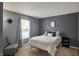 Neutral bedroom features a window, carpet, and wall decor at 14444 Black Farm Dr, Noblesville, IN 46060