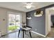 Cozy dining area with a modern table, sliding doors, and stylish accents at 14444 Black Farm Dr, Noblesville, IN 46060