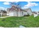 The side yard shows well-kept lawn, landscaping, vinyl siding, and a tree at 14444 Black Farm Dr, Noblesville, IN 46060