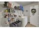 Functional laundry room featuring a washer and dryer with ample shelving at 14444 Black Farm Dr, Noblesville, IN 46060