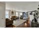 Spacious living room featuring hardwood floors, a plush rug, and a view into the dining area at 14444 Black Farm Dr, Noblesville, IN 46060