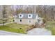 Charming one-story home featuring a cozy front porch and well-maintained yard, nestled in a serene wooded setting at 1527 N Washington St, Danville, IN 46122
