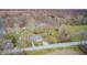 Charming cottage-style home boasts dormer windows and a quaint deck, nestled in a wooded landscape at 1527 N Washington St, Danville, IN 46122