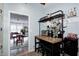 Eat-in kitchen bar with modern appliances, countertop storage, and a view into the dining and living room at 1527 N Washington St, Danville, IN 46122