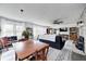 Spacious living room with comfortable seating, a dining table, and a stone fireplace, ideal for gatherings and relaxation at 1527 N Washington St, Danville, IN 46122