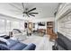 Well-lit living room with comfortable seating, a fireplace, and ample natural light, perfect for relaxation and entertaining at 1527 N Washington St, Danville, IN 46122