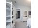 Airy bedroom with white accents, a decorative shelf, and a serene, inviting atmosphere at 1534 Cloverdon Dr, Westfield, IN 46074