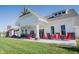 Inviting clubhouse featuring red rocking chairs on the front porch, perfect for relaxation and community gatherings at 1534 Cloverdon Dr, Westfield, IN 46074