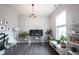 Stylish living room featuring a large window, modern decor, and natural lighting at 1534 Cloverdon Dr, Westfield, IN 46074