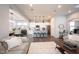Open concept view to a kitchen from the living room featuring modern decor and an island with seating at 1534 Cloverdon Dr, Westfield, IN 46074