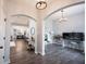 Open-concept living area showcases an archway, and a terrarium and plants at 1534 Cloverdon Dr, Westfield, IN 46074