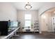 Living room with modern design, a terrarium, and a white storage unit at 1534 Cloverdon Dr, Westfield, IN 46074