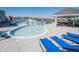 A refreshing community pool with lounge chairs, umbrellas, and a gazebo, ideal for summer relaxation and recreation at 1534 Cloverdon Dr, Westfield, IN 46074