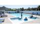 Sparkling community pool with clear blue water, surrounded by lounge chairs and a gazebo, perfect for summer relaxation at 1534 Cloverdon Dr, Westfield, IN 46074