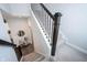 Staircase with carpet, contrasting dark metal rails, and a view to the lower level at 1534 Cloverdon Dr, Westfield, IN 46074