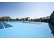 Well-maintained tennis courts with blue playing surfaces, offering residents an opportunity for active recreation at 1534 Cloverdon Dr, Westfield, IN 46074