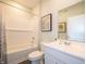 Clean bathroom with white subway tiles, tub and shower combination, and modern vanity at 1571 Beyers St, Fortville, IN 46040