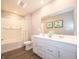 Bathroom with a double sink vanity and a white shower tub combination at 1571 Beyers St, Fortville, IN 46040