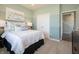 Comfortable bedroom featuring soft carpet, stylish decor, and ample natural light at 1571 Beyers St, Fortville, IN 46040
