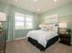 Cozy bedroom with a large window, carpeted floors, and calming color scheme at 1571 Beyers St, Fortville, IN 46040
