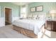 Bright bedroom featuring a large bed, complementary artwork, and an adjoining bathroom at 1571 Beyers St, Fortville, IN 46040