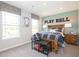 Bright bedroom with two windows, sporty decor, and a cozy plaid comforter at 1571 Beyers St, Fortville, IN 46040