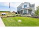 Beautiful two-story home with lush green lawn and manicured landscaping at 1571 Beyers St, Fortville, IN 46040